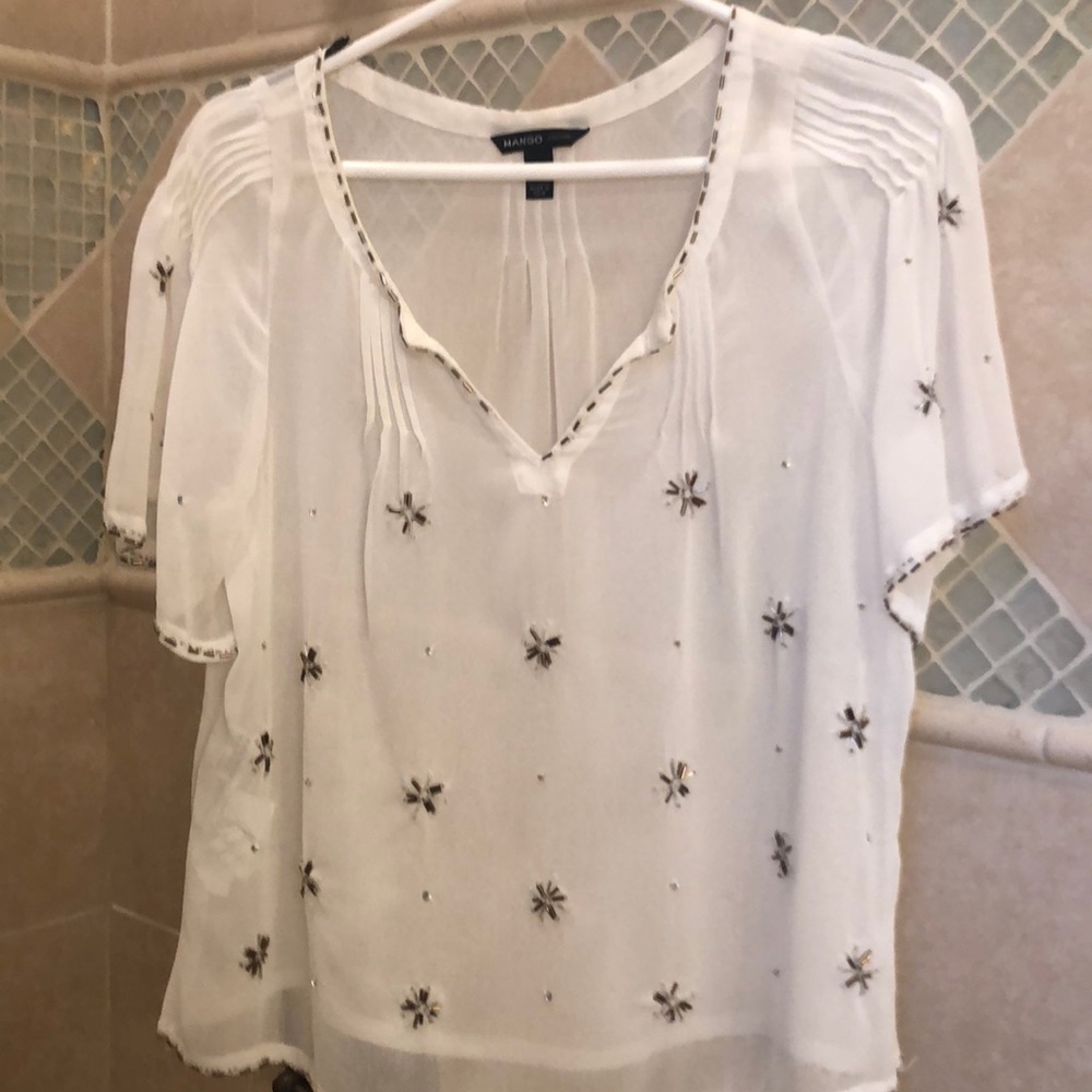 Basically like new mango white beaded blouse